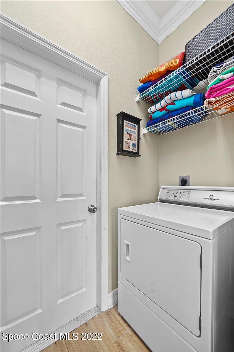 245 Clyde Street Melbourne Beach, FL 32951 - Photo 28 of 47 a utility room with dryer and washer