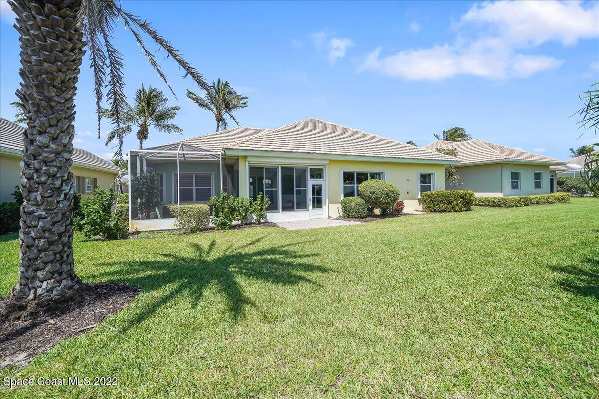 245 Clyde Street Melbourne Beach, FL 32951 - Photo 30 of 47 a front view of a house with a yard