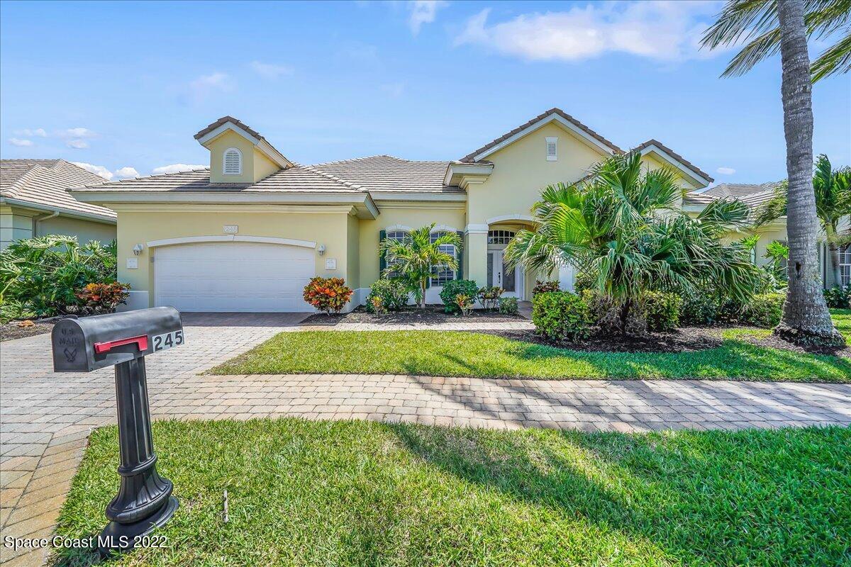 245 Clyde Street Melbourne Beach, FL 32951 - Photo 33 of 47 a front view of a house with garden