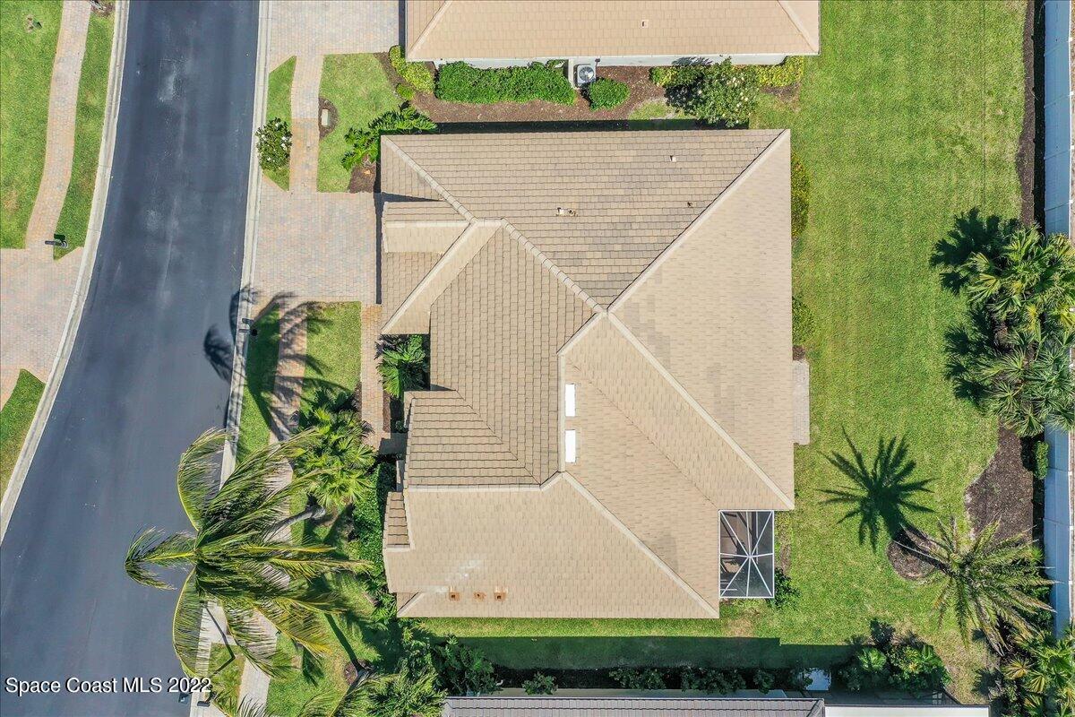 245 Clyde Street Melbourne Beach, FL 32951 - Photo 35 of 47 a view of a house with a yard