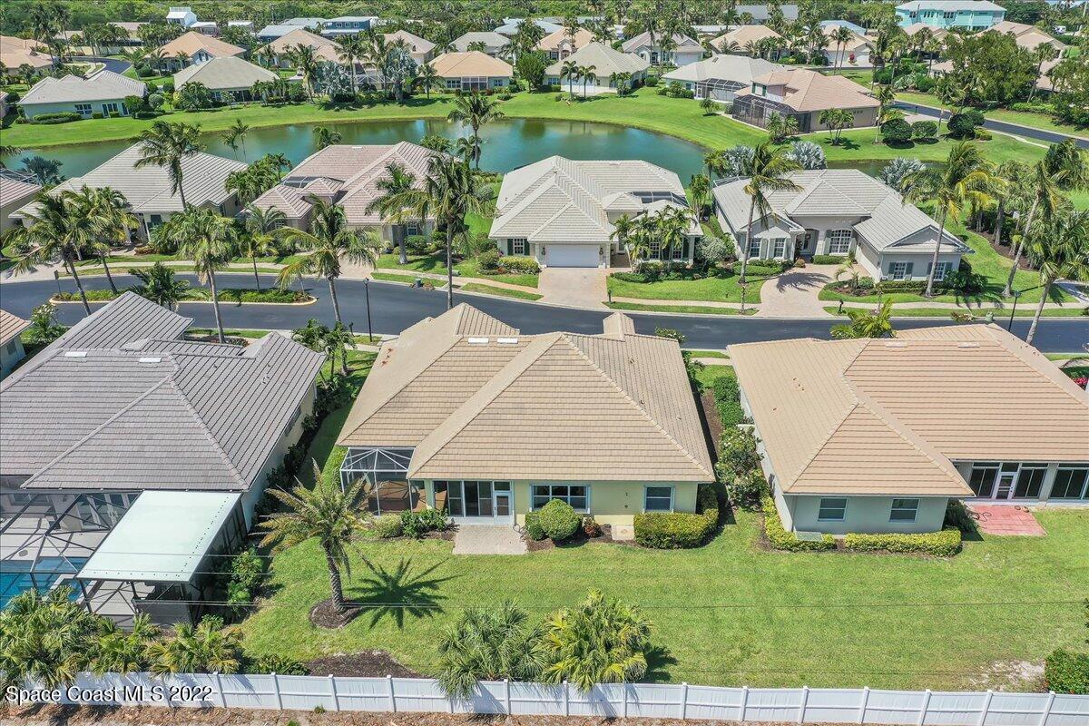 245 Clyde Street Melbourne Beach, FL 32951 - Photo 36 of 47 an aerial view of a house with a garden and lake view