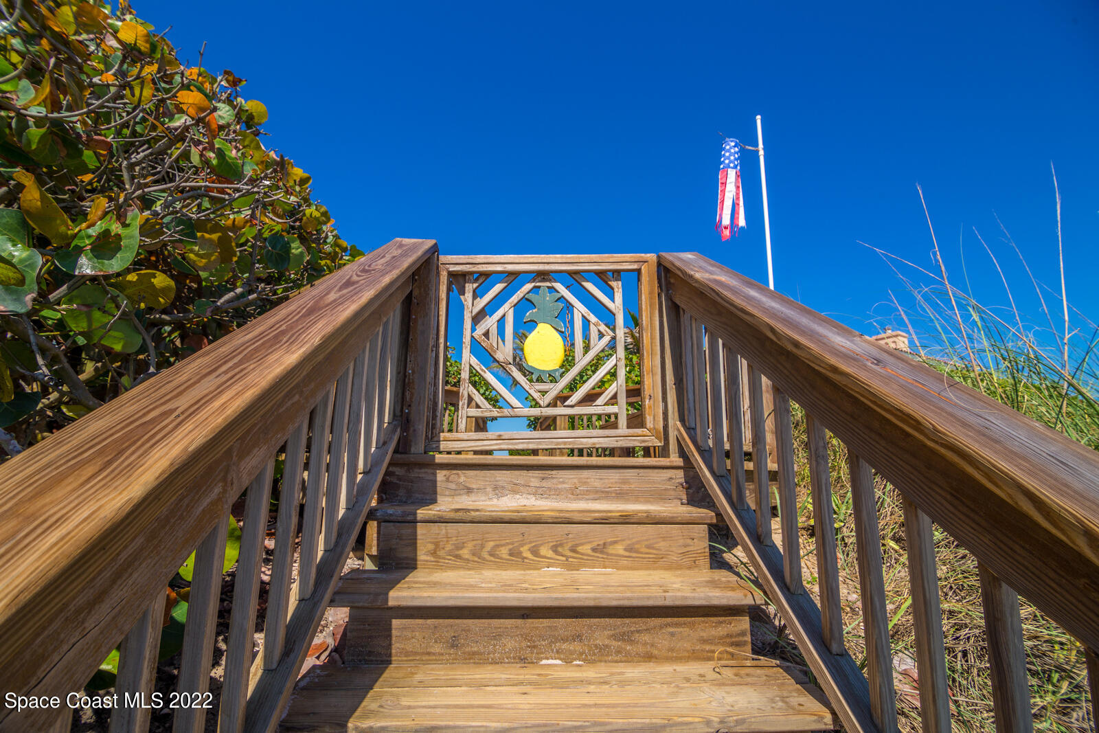 245 Clyde Street Melbourne Beach, FL 32951 - Photo 40 of 47 a view of stairs with wooden floor