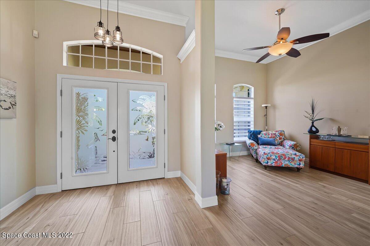 245 Clyde Street Melbourne Beach, FL 32951 - Photo 6 of 47 a living room with furniture and wooden floor