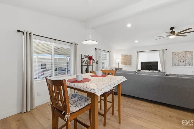a view of a dining room with furniture and window