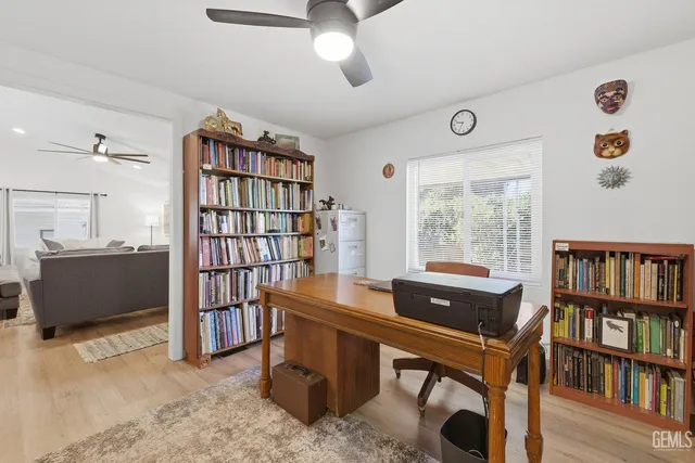 a work room with furniture and book shelf