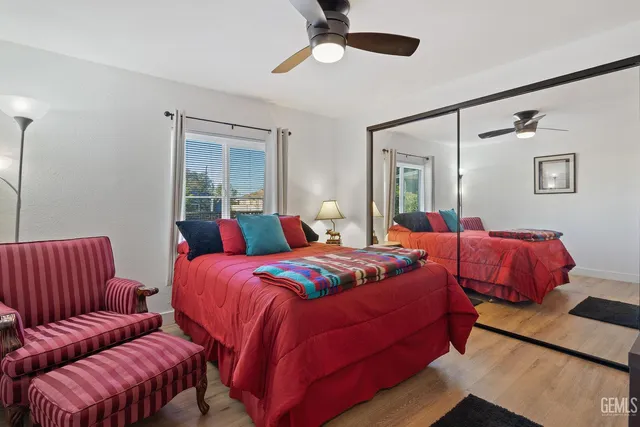 a bedroom with bed and a couch