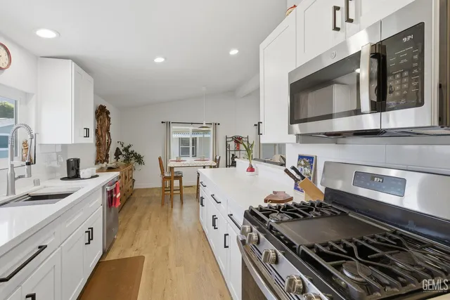 a kitchen with a stove and a sink