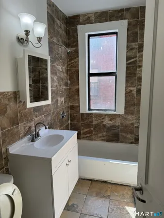 a bathroom with a sink and a bathtub