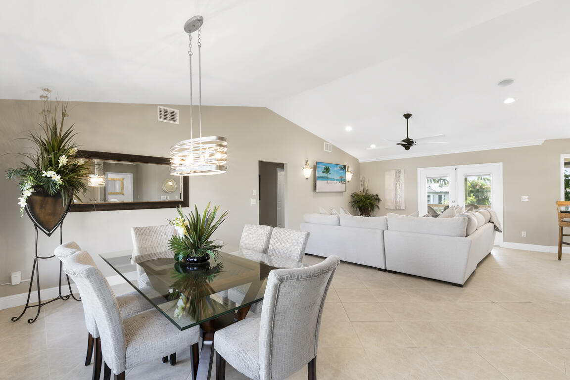 110 June Court Marco Island, FL 34145 - Photo 2 of 41 a dining room with furniture a chandelier and window