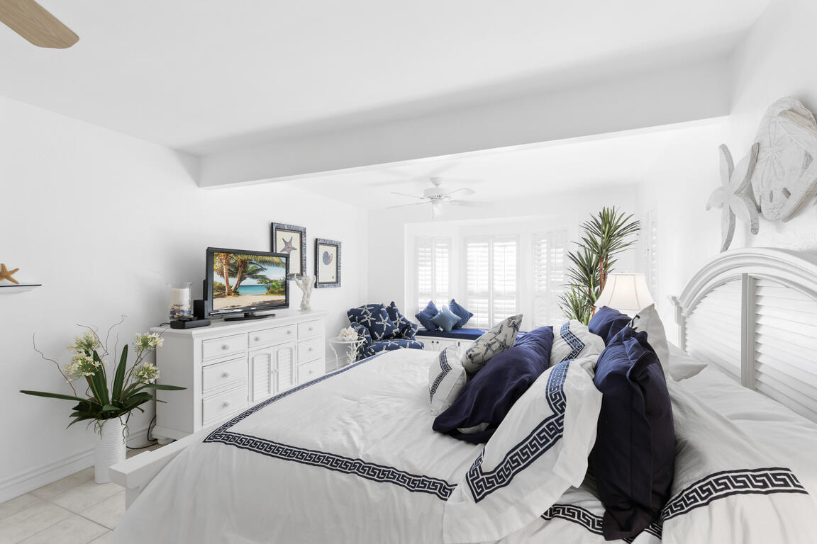110 June Court Marco Island, FL 34145 - Photo 13 of 41 a living room with furniture potted plant and a flat screen tv