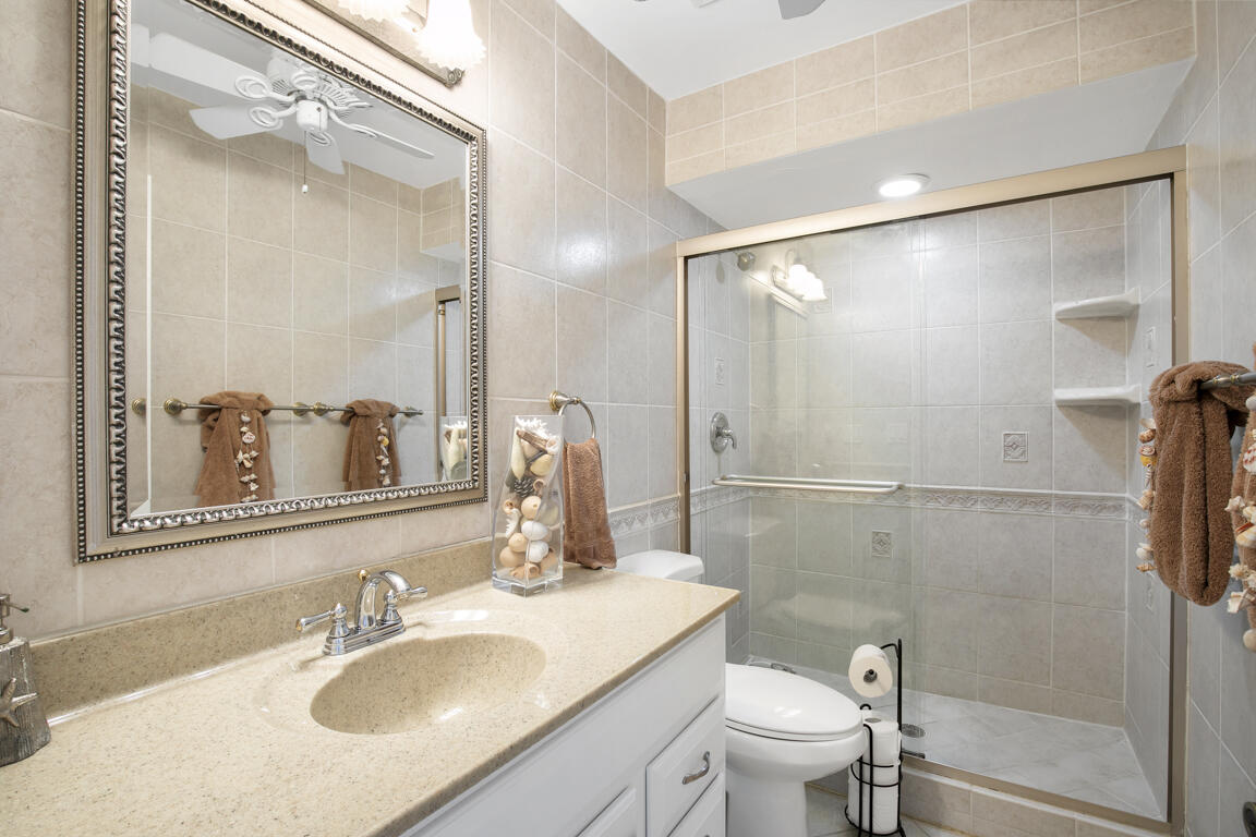 110 June Court Marco Island, FL 34145 - Photo 17 of 41 a bathroom with a sink toilet and shower