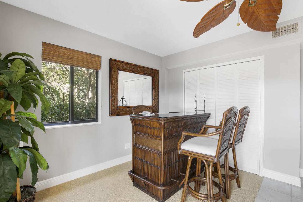 110 June Court Marco Island, FL 34145 - Photo 20 of 41 a dining room with furniture and a potted plant