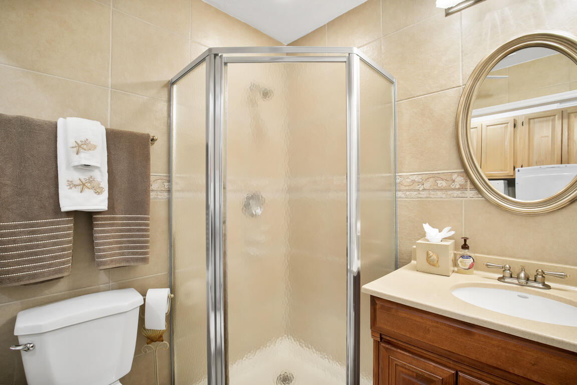 110 June Court Marco Island, FL 34145 - Photo 23 of 41 a bathroom with a sink vanity mirror and toilet