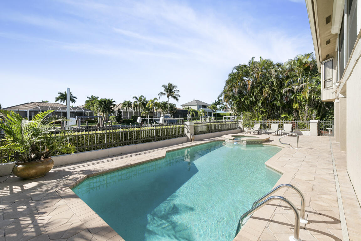 110 June Court Marco Island, FL 34145 - Photo 31 of 41 a view of a swimming pool with a patio