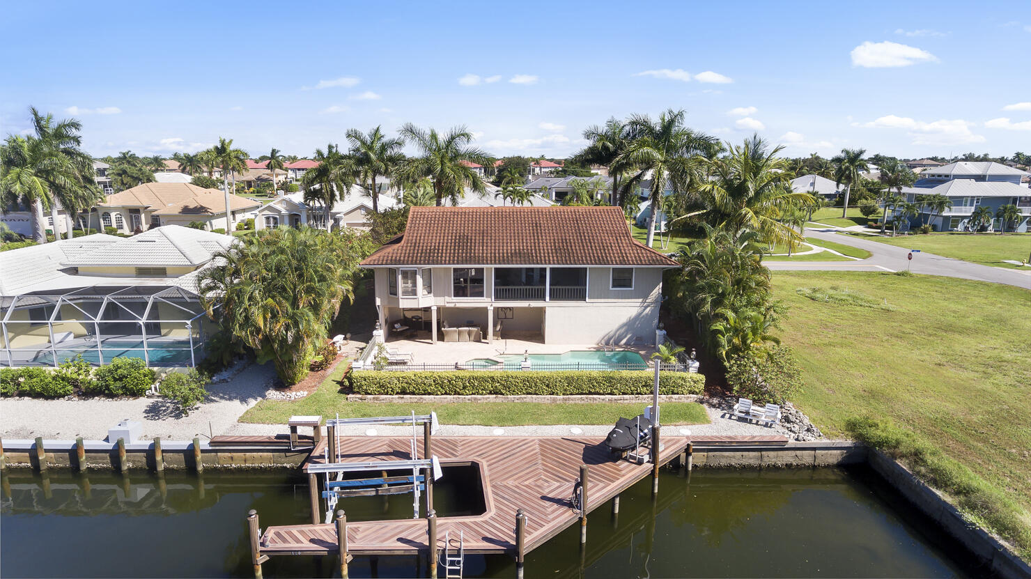 110 June Court Marco Island, FL 34145 - Photo 36 of 41 a view of a lake with houses