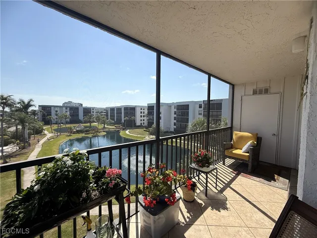 a bathroom with a granite countertop toilet sink and a mirror