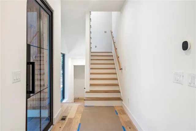 a view of a hallway with staircase