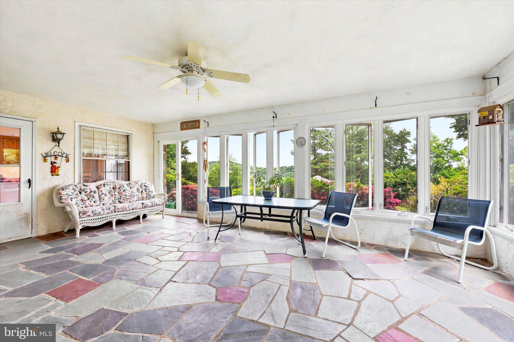 1646 Fairview Road Glenmoore, PA 19343 - Photo 11 of 29 Sunlit sunroom with scenic views.