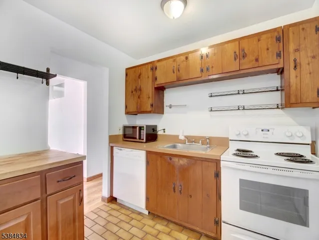 a kitchen with stainless steel appliances granite countertop a stove and a refrigerator