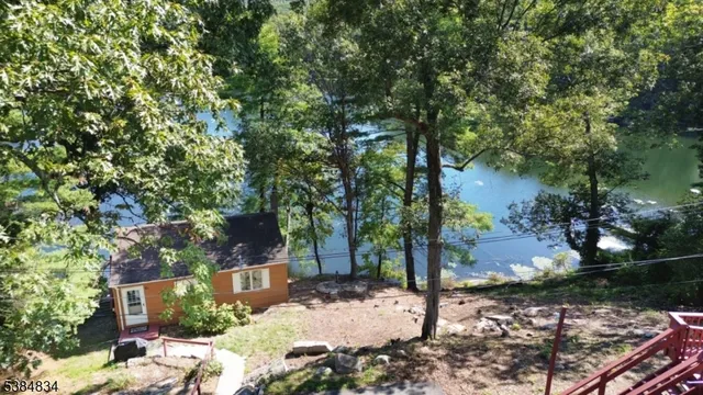 a view of a tree in front of a house