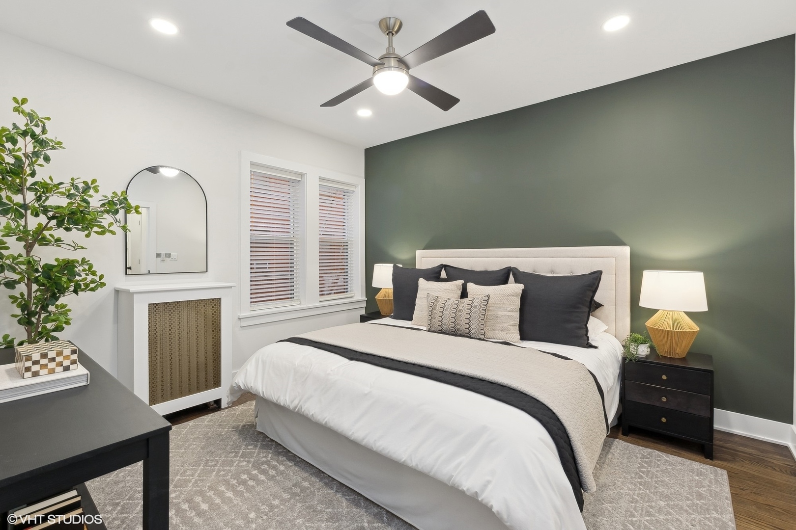 1323 West Addison Street, Unit 1A Chicago, IL 60613 - Photo 11 of 15 a bedroom with bed and a chandelier