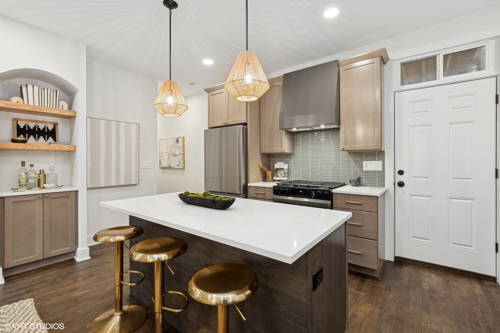 1323 West Addison Street, Unit 1A Chicago, IL 60613 - Photo 5 of 15 a kitchen with a table chairs refrigerator and cabinets