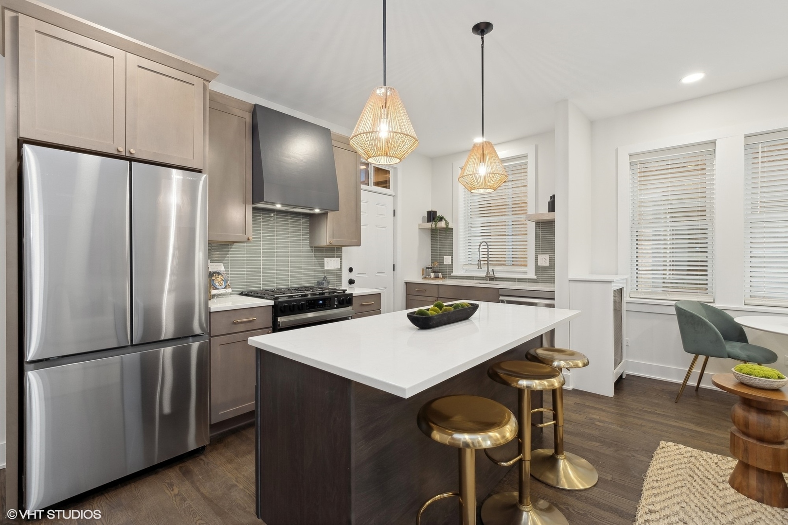 1323 West Addison Street, Unit 1A Chicago, IL 60613 - Photo 6 of 15 a kitchen with refrigerator and chairs
