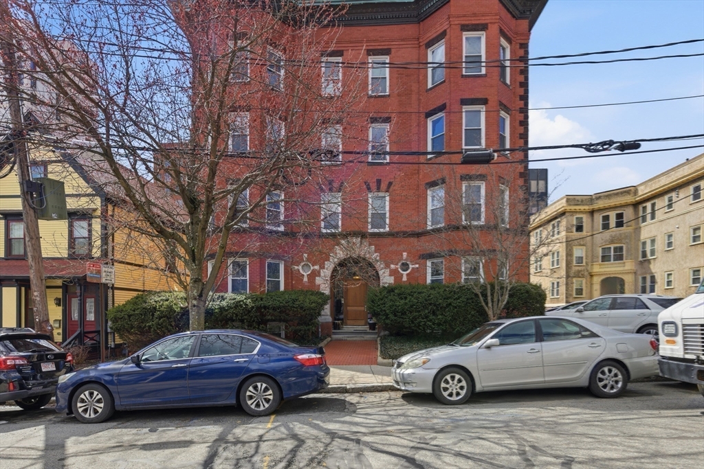 18 Centre Street, Unit 304 Cambridge, MA 02139 - Photo 15 of 17 a car parked in front of a building