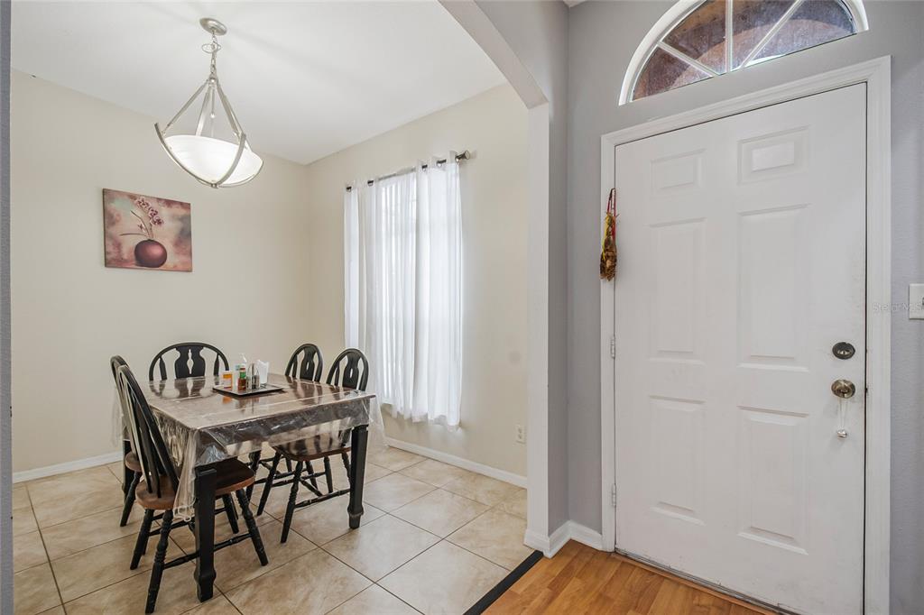 2782 Andes Way St. Cloud, FL 34769 - Photo 17 of 42 a view of a dining room with furniture and window