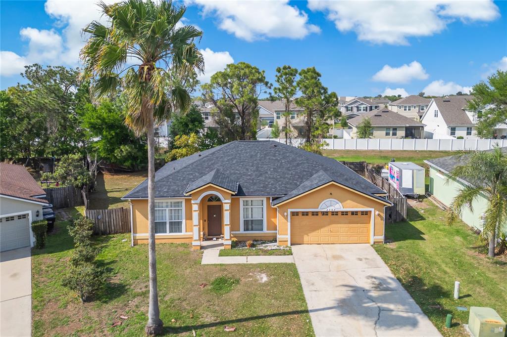 2782 Andes Way St. Cloud, FL 34769 - Photo 2 of 42 a aerial view of a house with swimming pool and a chairs