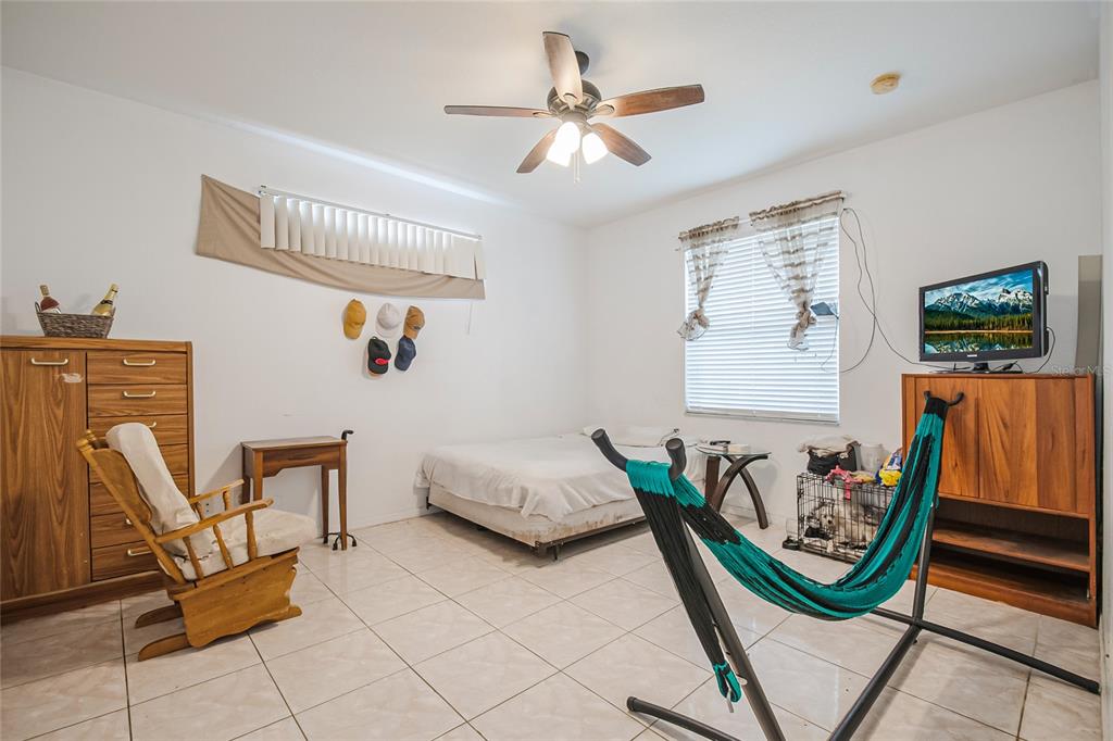 2782 Andes Way St. Cloud, FL 34769 - Photo 29 of 42 a bedroom with furniture and a window