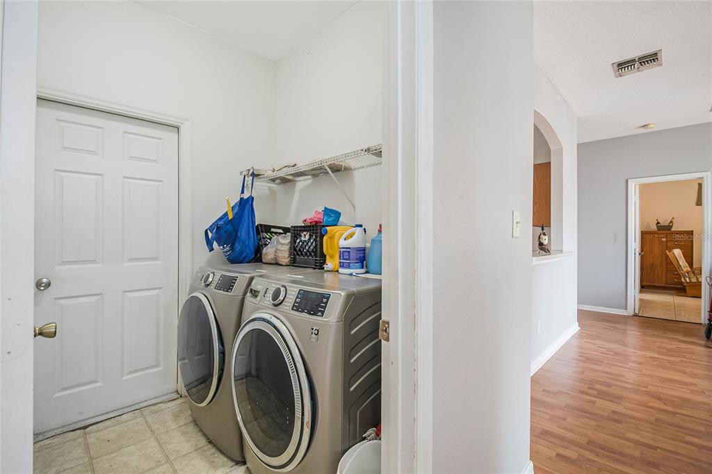 2782 Andes Way St. Cloud, FL 34769 - Photo 35 of 42 a view of a hallway with washer and dryer