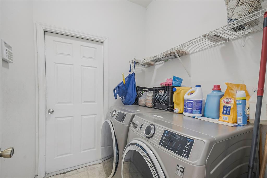 2782 Andes Way St. Cloud, FL 34769 - Photo 36 of 42 a utility room with dryer and washer