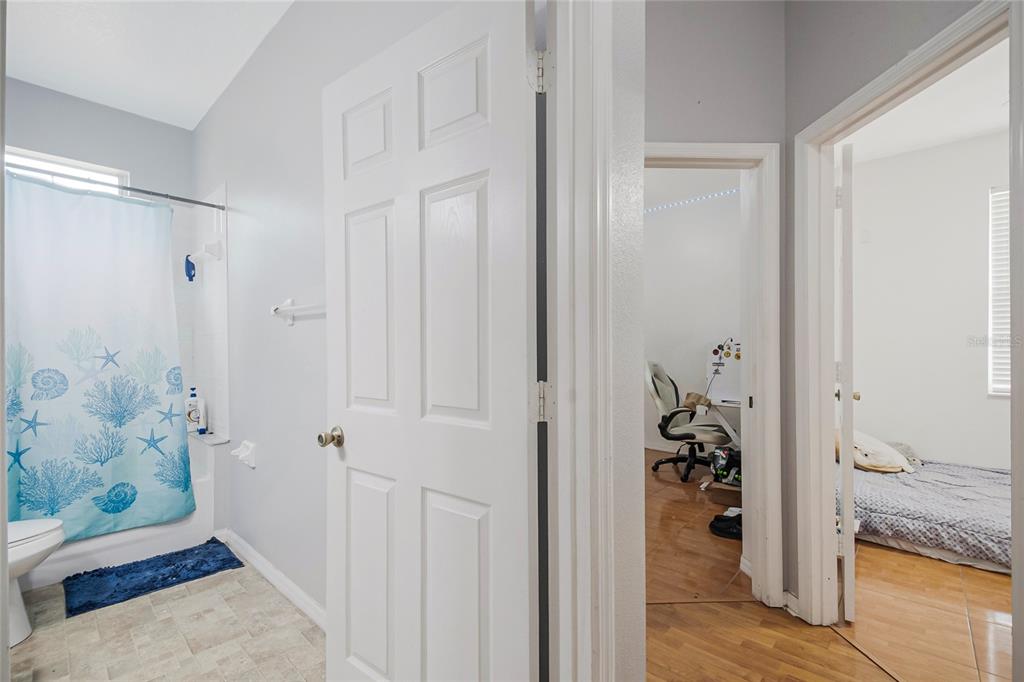 2782 Andes Way St. Cloud, FL 34769 - Photo 37 of 42 a bathroom with a granite countertop tub shower and sink