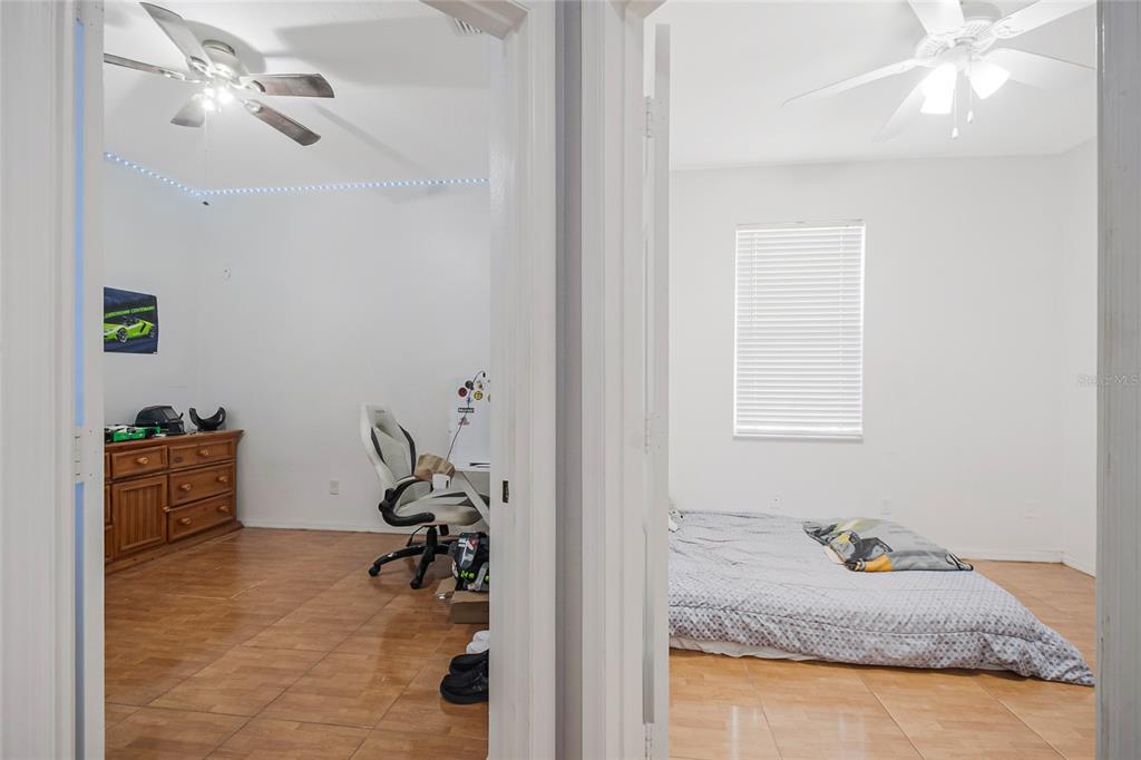 2782 Andes Way St. Cloud, FL 34769 - Photo 39 of 42 a bedroom with furniture and a window