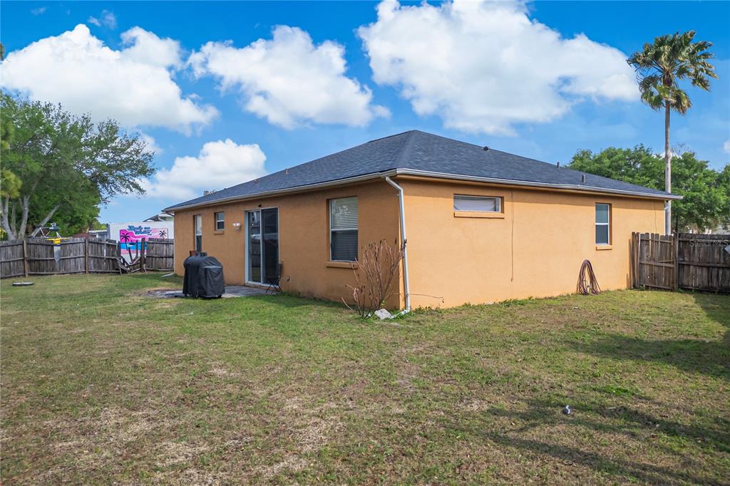 2782 Andes Way St. Cloud, FL 34769 - Photo 7 of 42 a view of a backyard with a house