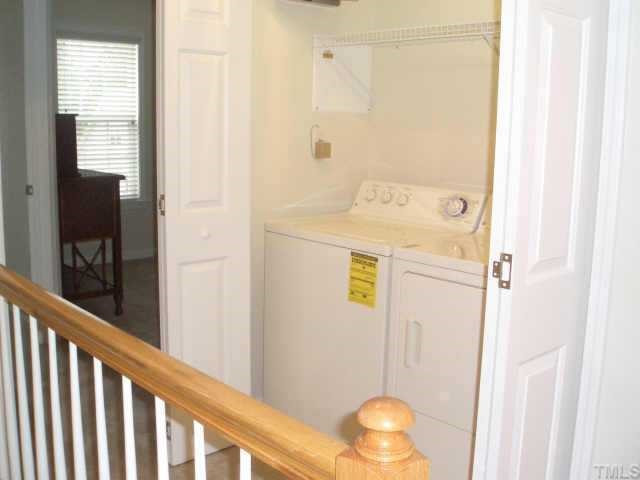 4415 Log Cabin Drive Raleigh, NC 27616 - Photo 5 of 10 GE Washer and Dryer come with this townhome! Both are located upstairs for ease and convenience. Note the shelving above the W/D for more storage! Other