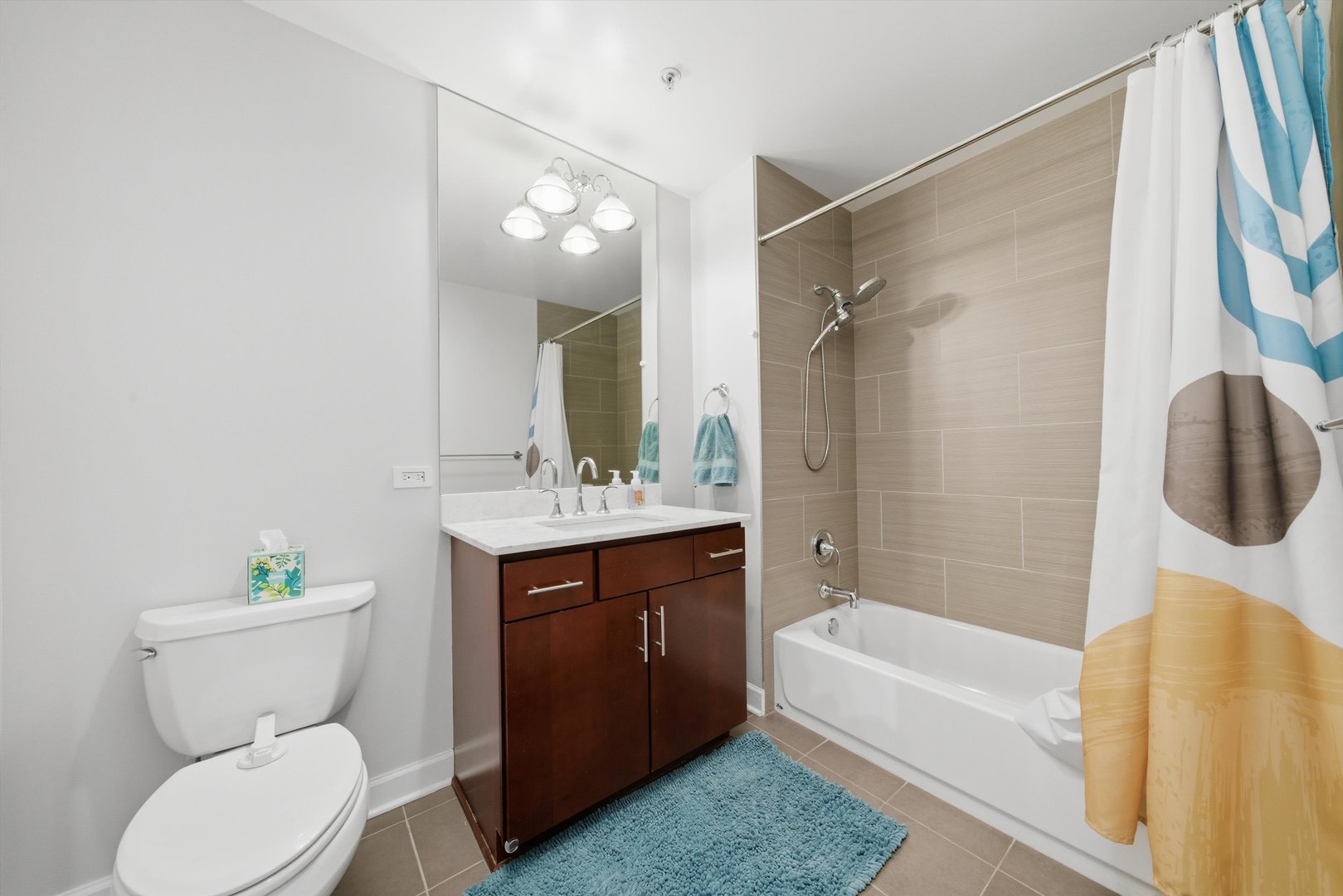 100 East 14th Street, Unit 1401 Chicago, IL 60605 - Photo 15 of 28 a bathroom with a sink toilet and shower