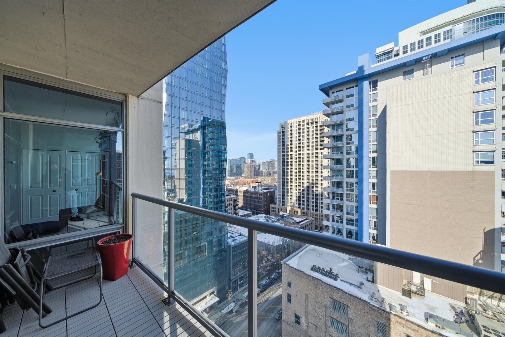 100 East 14th Street, Unit 1401 Chicago, IL 60605 - Photo 17 of 28 a view of balcony with two chairs and a potted plant