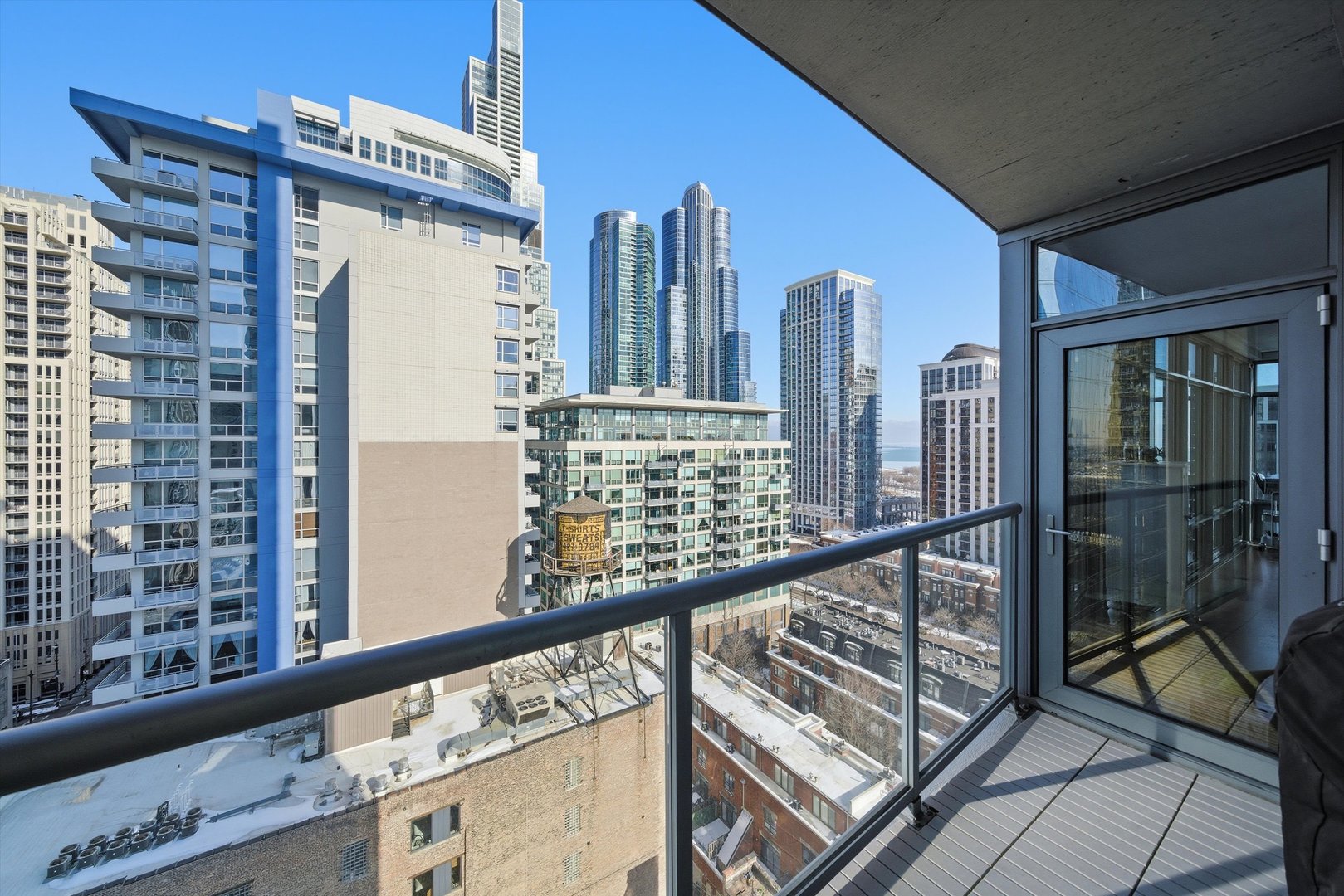 100 East 14th Street, Unit 1401 Chicago, IL 60605 - Photo 18 of 28 a view of a balcony with chairs and iron stairs