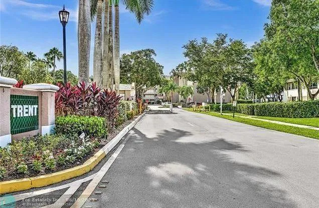 an aerial view of residential house with outdoor space and swimming pool