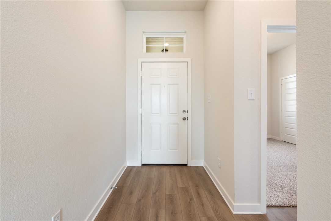 2415 Rooke Road Bryan, TX 77807 - Photo 5 of 36 a view of a hallway with wooden floor