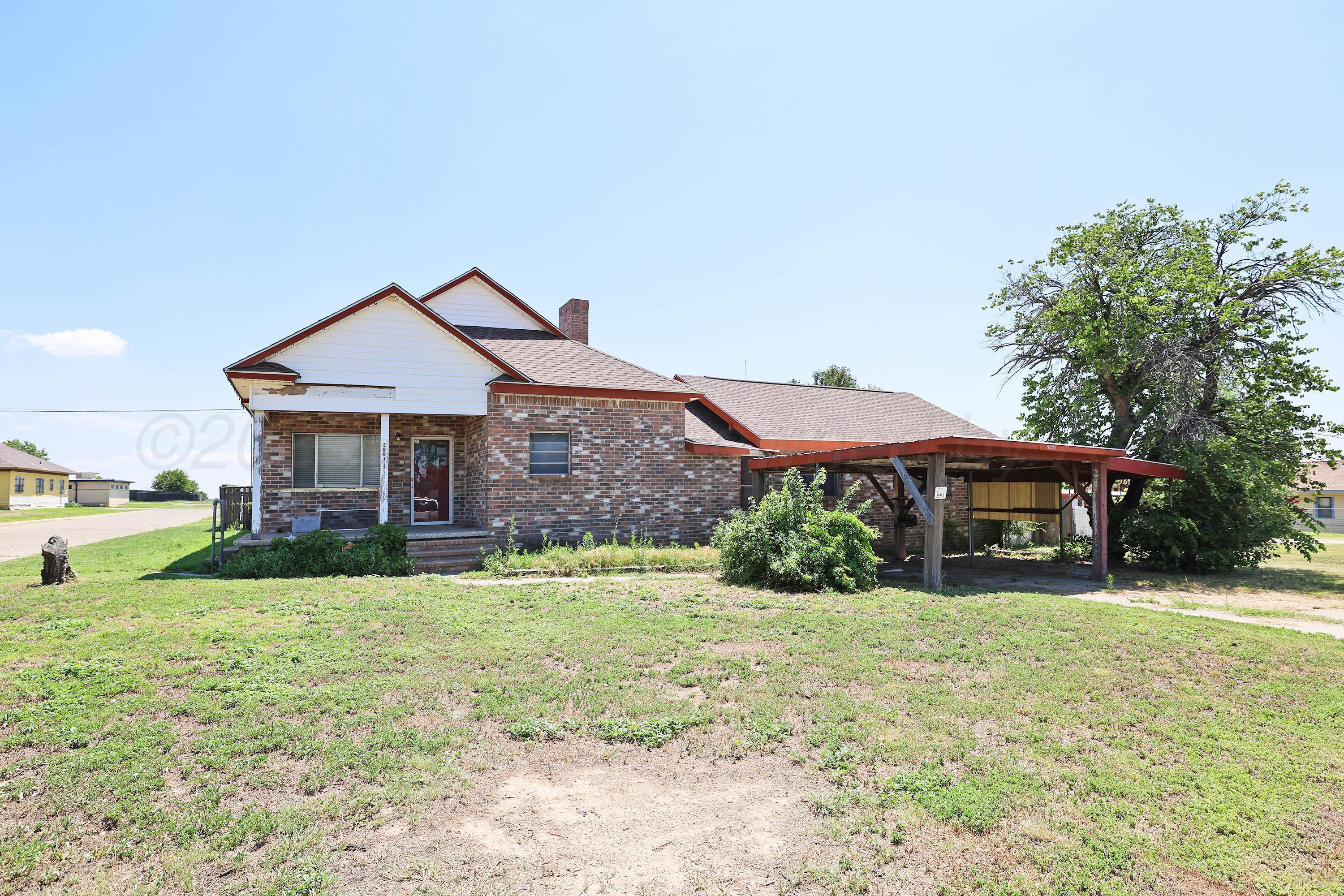 2001 Northwest 13th Avenue Amarillo, TX 79107 - Photo 1 of 35 a front view of a house with garden