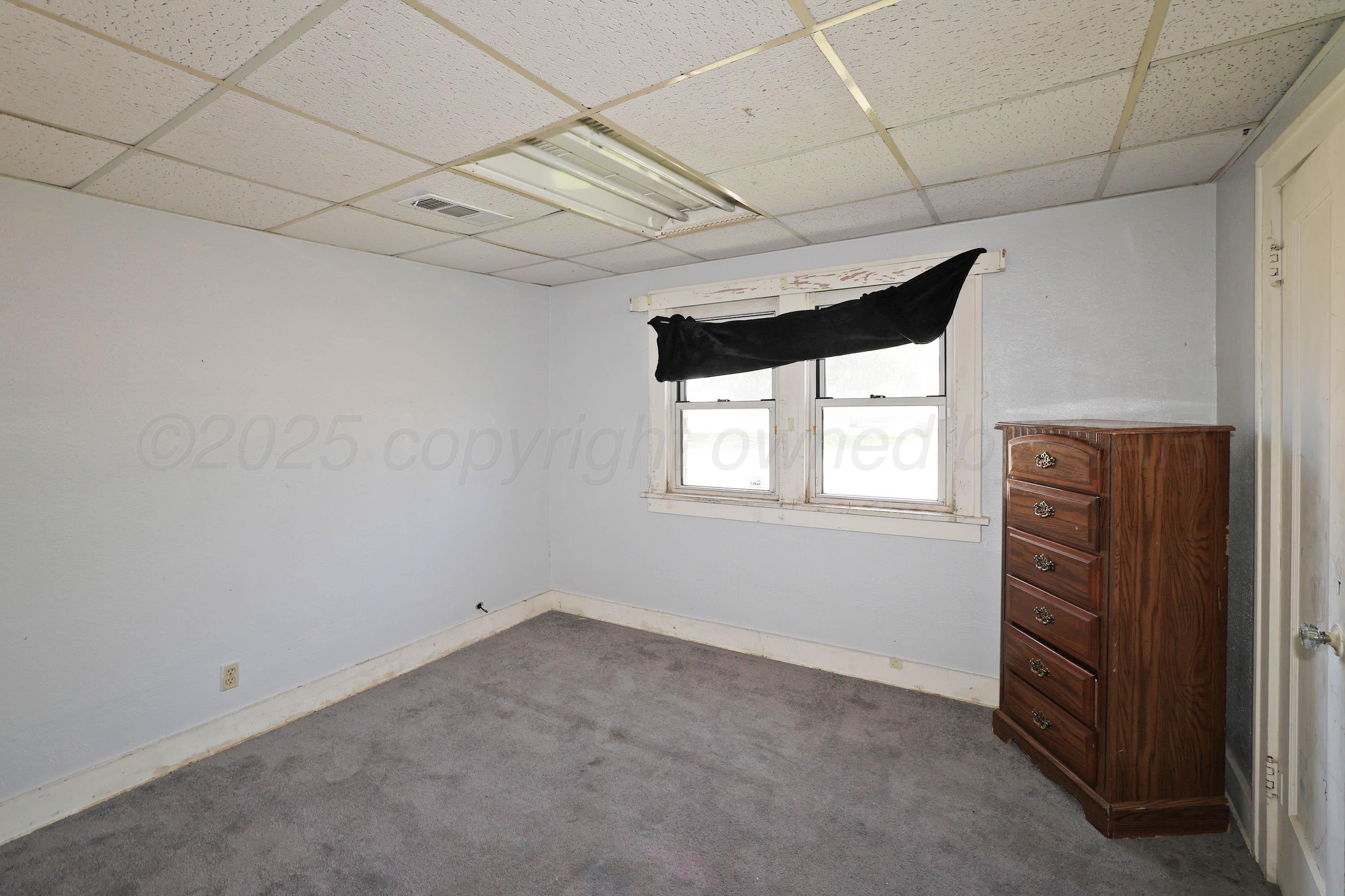 2001 Northwest 13th Avenue Amarillo, TX 79107 - Photo 22 of 35 a view of room with window and furniture