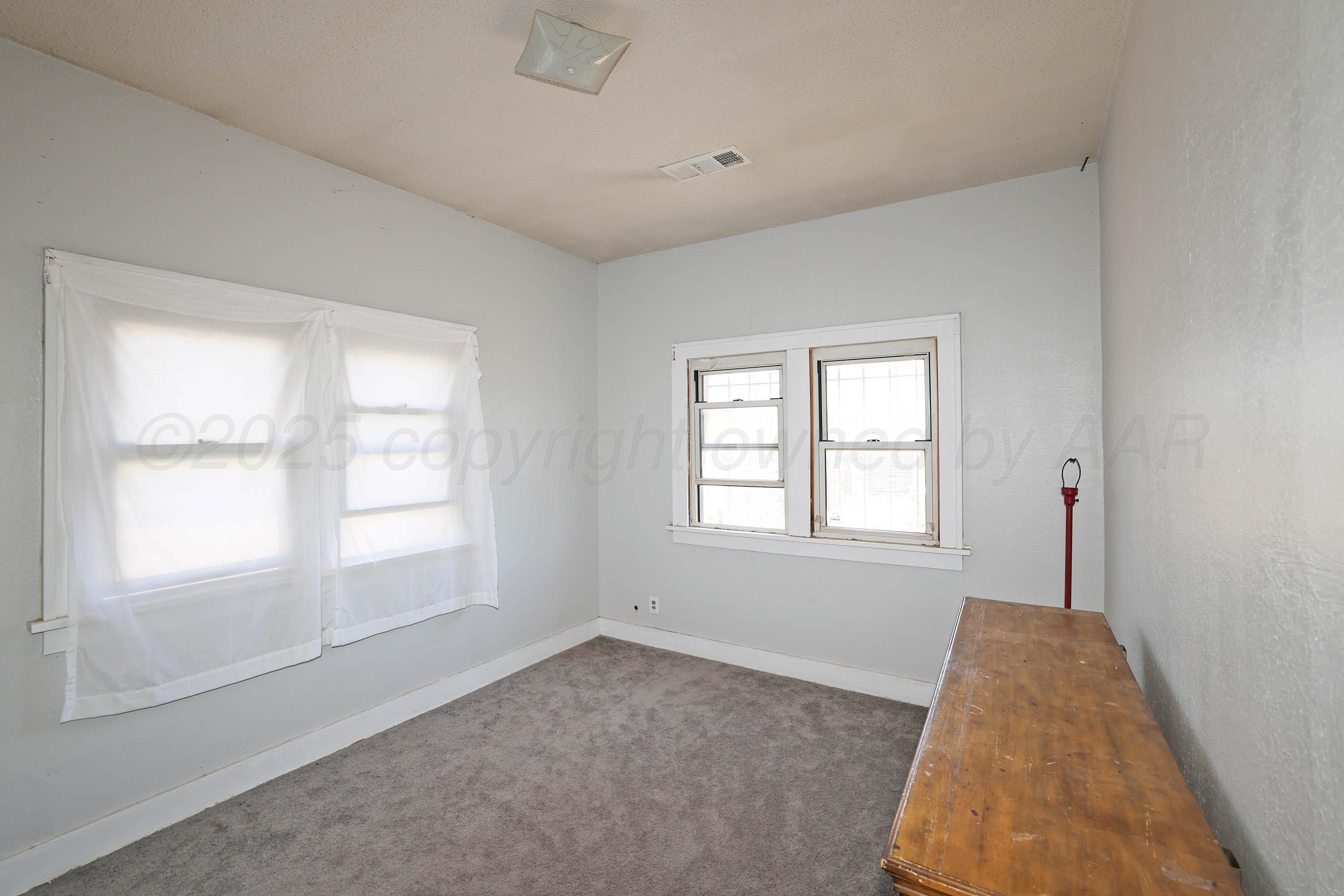 2001 Northwest 13th Avenue Amarillo, TX 79107 - Photo 23 of 35 an empty room with a window
