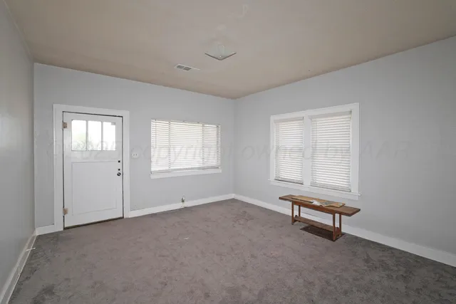 a view of an empty room with window