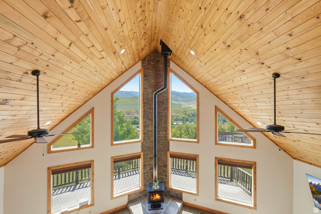 306 Spring Road Preston, ID 83263 - Photo 9 of 55 Vaulted wood-paneled ceiling with recessed lighting and ceiling fans