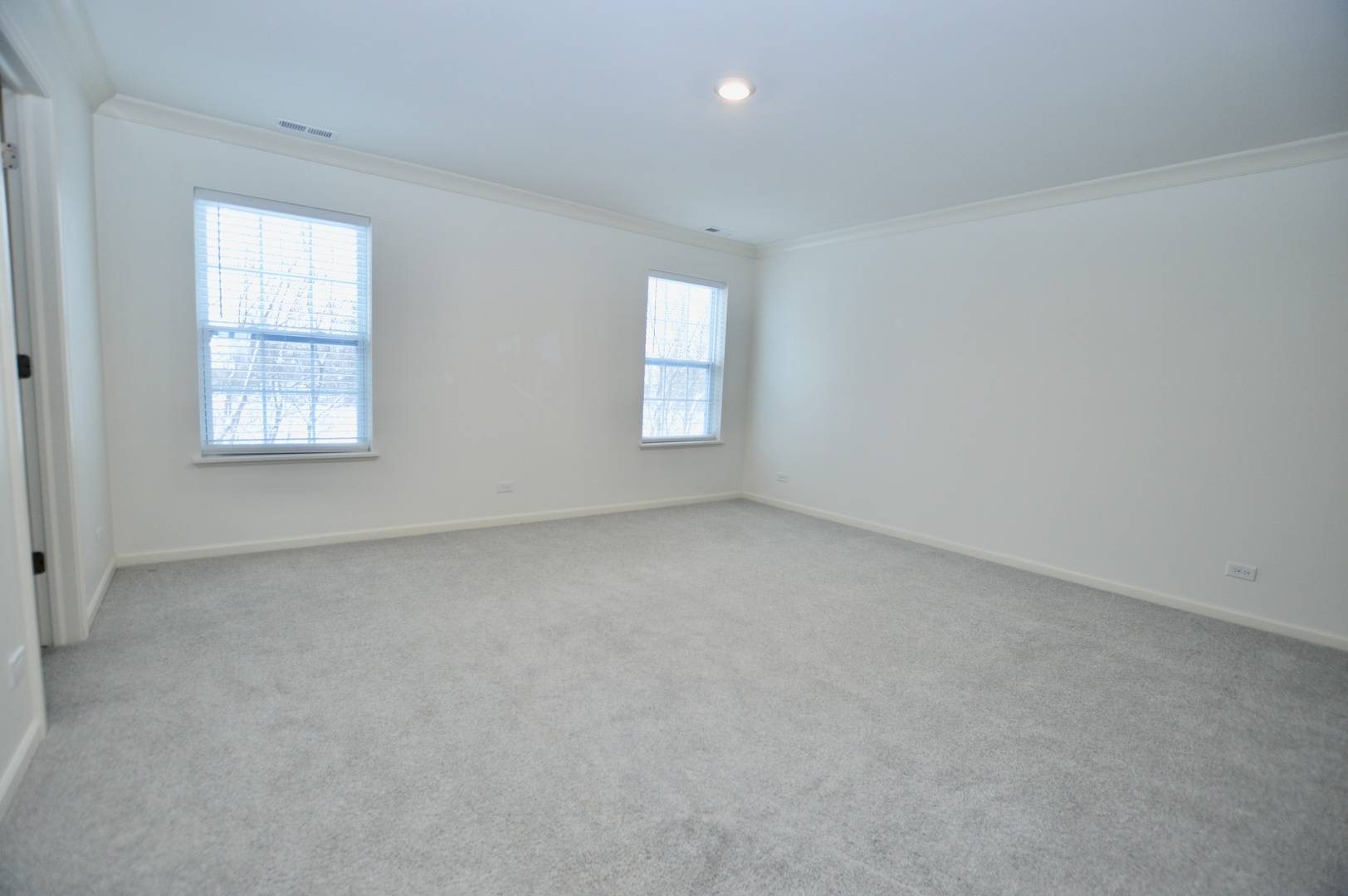 1029 Draper Road McHenry, IL 60050 - Photo 16 of 26 an empty room with windows