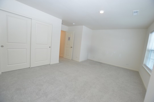 1029 Draper Road McHenry, IL 60050 - Photo 17 of 26 a view of an empty room and a window
