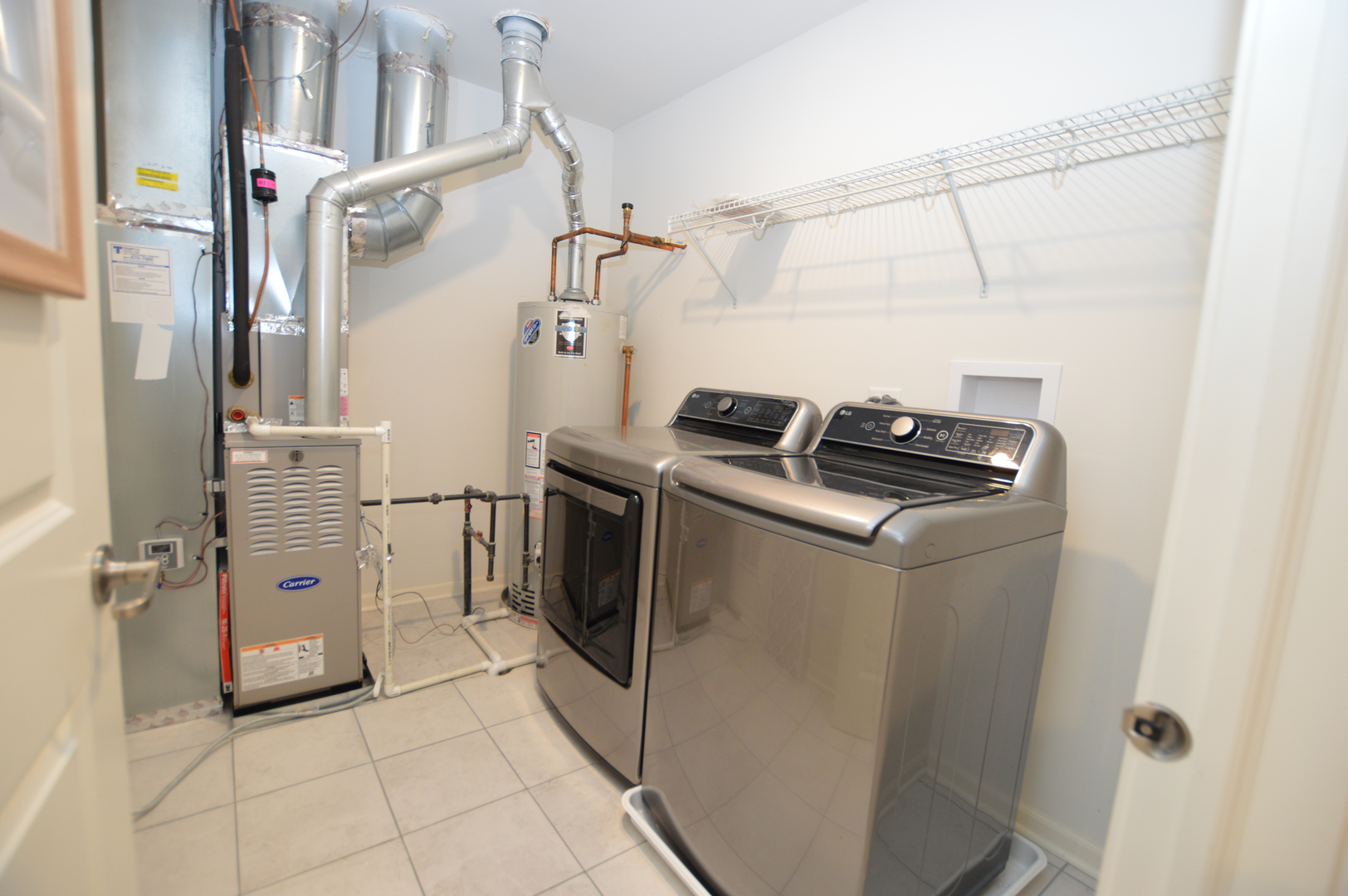 1029 Draper Road McHenry, IL 60050 - Photo 22 of 26 a utility room with closet dryer and washer